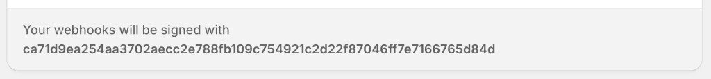 The webhook signing secret shown at the bottom of the Shopify Webhooks page